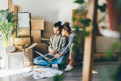 Young woman using laptop at home