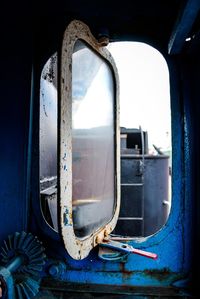 Close-up of abandoned train window