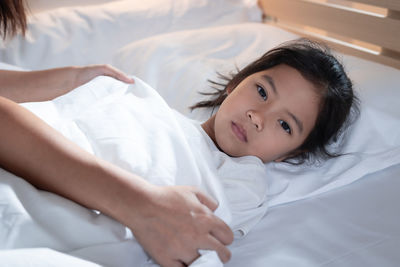 Cute boy lying on bed