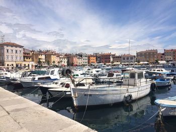 Boats moored at harbor