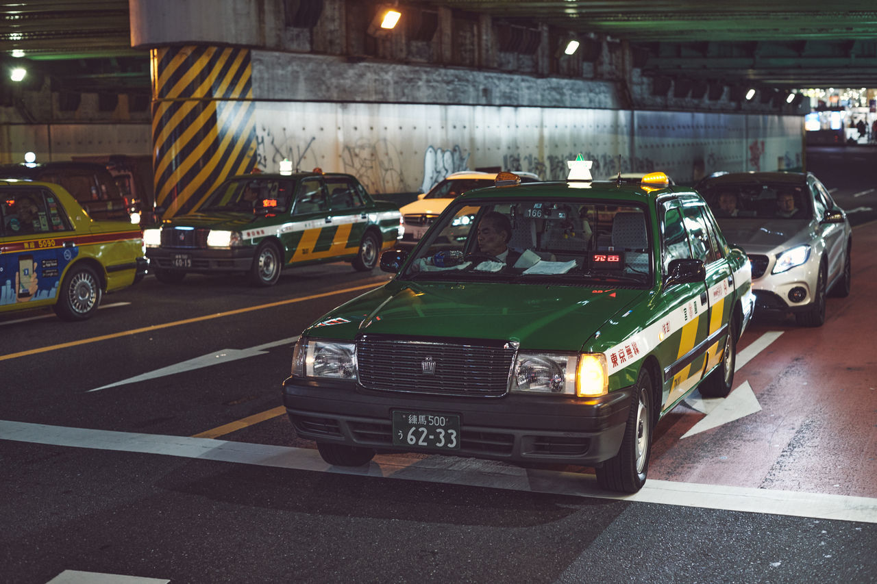 VEHICLES ON ROAD AT NIGHT