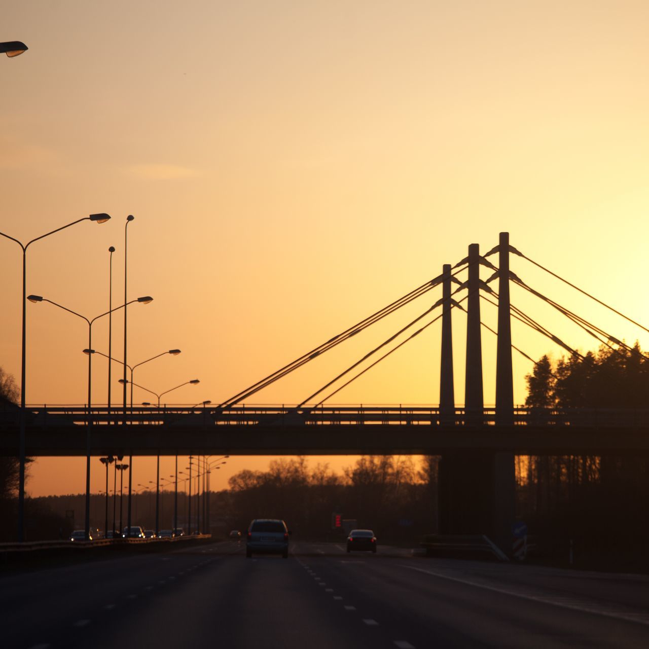 transportation, connection, bridge - man made structure, car, sunset, land vehicle, road, built structure, engineering, architecture, clear sky, mode of transport, suspension bridge, bridge, copy space, the way forward, traffic, sky, on the move, street