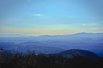 Scenic view of mountains against sky during sunset