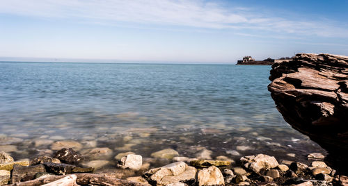 Scenic view of sea against cloudy sky