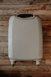 Directly above shot of white table against wooden wall