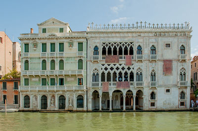 Sailing through the canals in venice admiring the ancient buildings