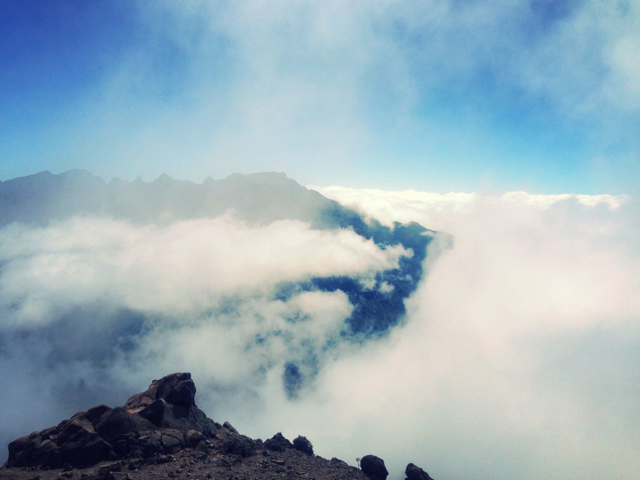 mountain, scenics, tranquil scene, sky, tranquility, beauty in nature, cloud - sky, nature, mountain range, idyllic, cloud, cloudy, majestic, landscape, non-urban scene, physical geography, geology, low angle view, day, rock - object