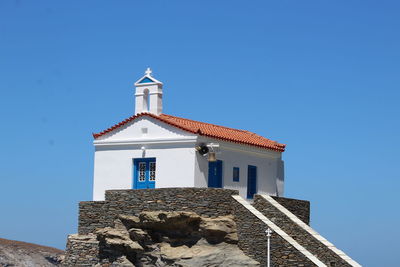 Low angle view of building against clear blue sky