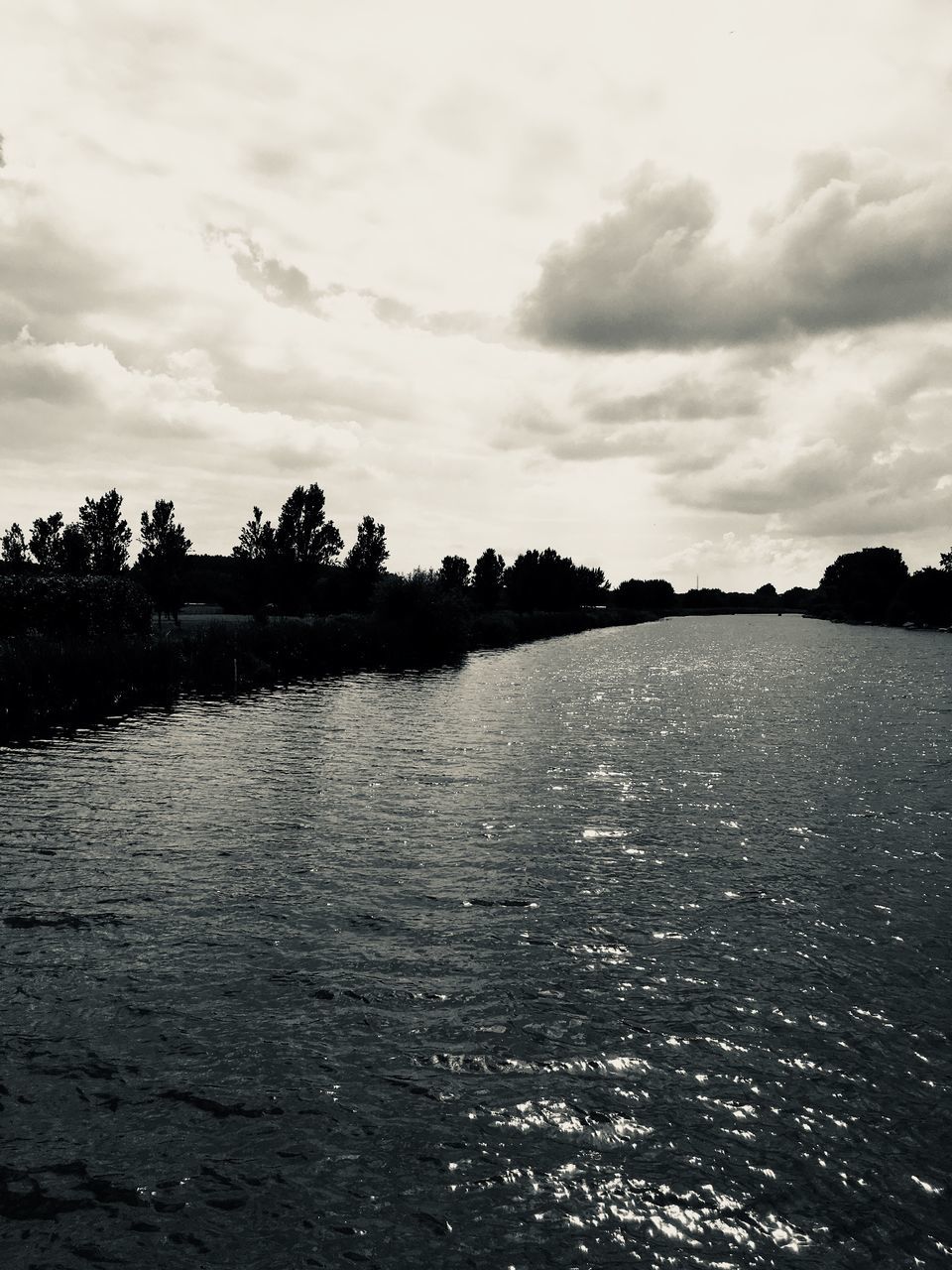 water, sky, cloud - sky, tranquility, scenics - nature, tranquil scene, tree, beauty in nature, lake, waterfront, nature, no people, plant, silhouette, non-urban scene, outdoors, day