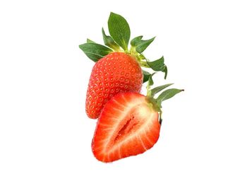 Close-up of strawberry over white background