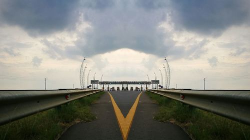 View of suspension bridge against cloudy sky