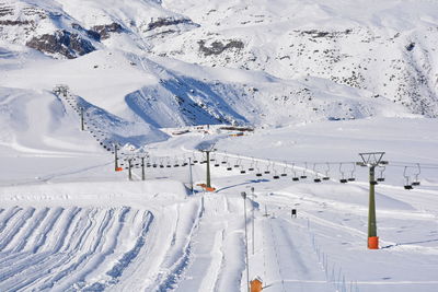 High angle view of ski lift over snowcapped mountain