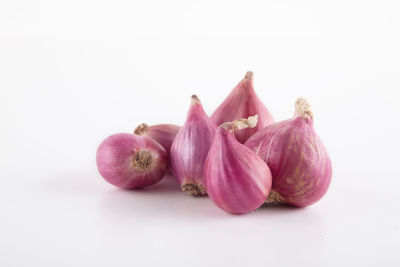 Close-up of garlic against white background