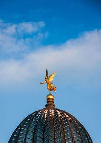 Low angle view of statue against sky