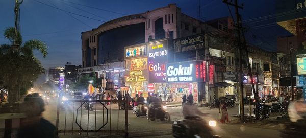 People on city street at night