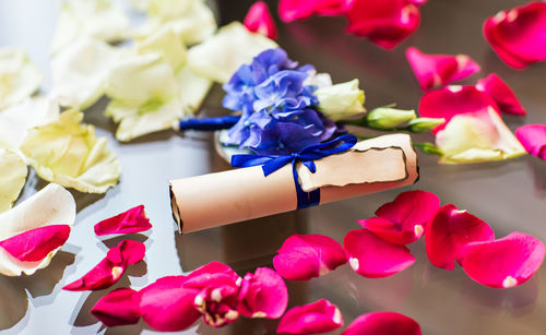 Close-up of pink roses on table