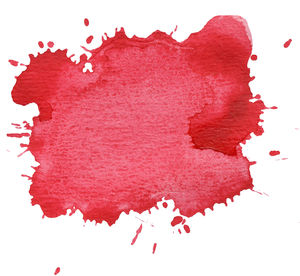 Close-up of red water on white background