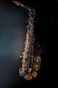 High angle view of saxophone on table