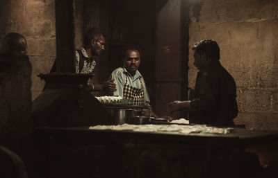 People sitting by table