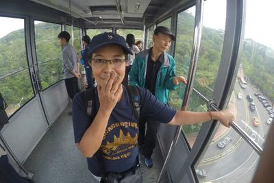 Rear view of woman sitting in train