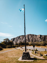 Low angle view of rock formation on land against sky