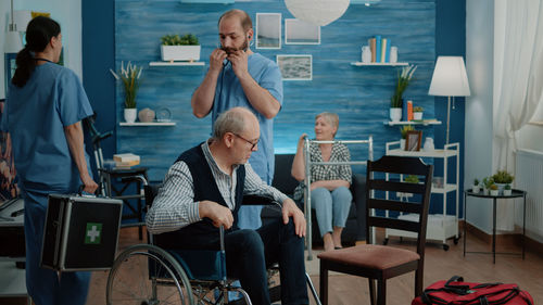 Patient and doctors in clinic