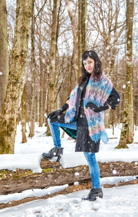 Full length portrait of woman in snow