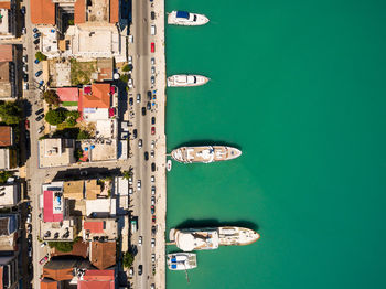 High angle view of buildings by sea in city