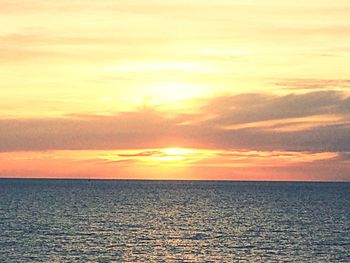 Scenic view of sea at sunset