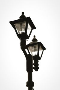 Low angle view of lantern on street light