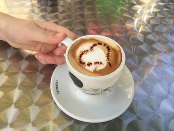 High angle view of coffee cup on table