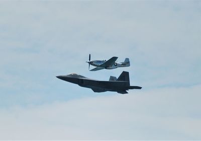 Low angle view of airplane flying in sky