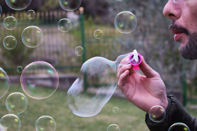 Reflection of man in bubbles