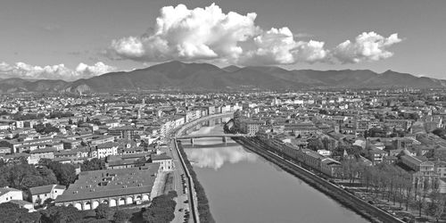 High angle view of river amidst buildings against sky