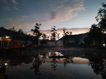 Scenic view of lake against sky at sunset