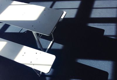 High angle view of chairs on table