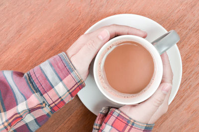 High angle view of coffee cup on table