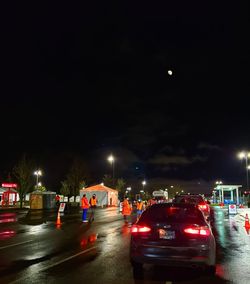 Cars on road in city at night