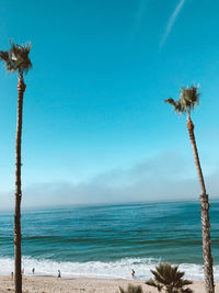 Scenic view of sea against blue sky