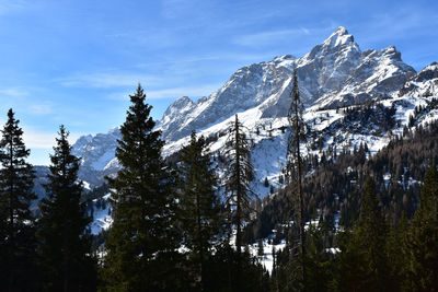 Low angle view of snowcapped mountain against sky