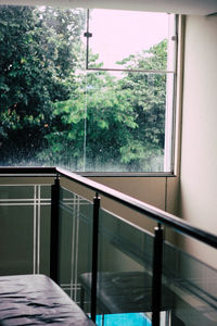 Glass railing against window at home
