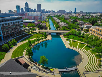 High angle view of canal by buildings in city