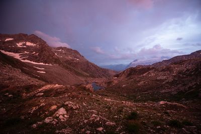 Scenic view of mountains against sky at dusk