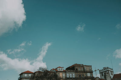 Low angle view of buildings against blue sky