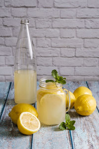 Fruits in glass jar on table