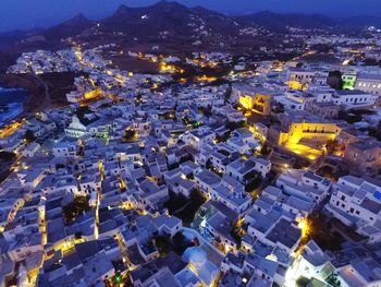 High angle view of illuminated buildings in city at night