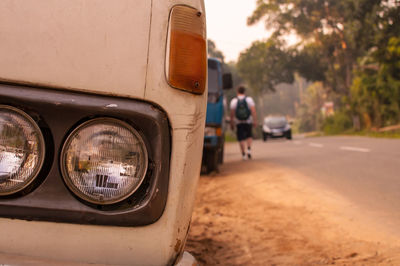 Reflection of man in car