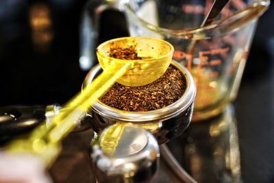 Close-up of coffee in glass jar on table