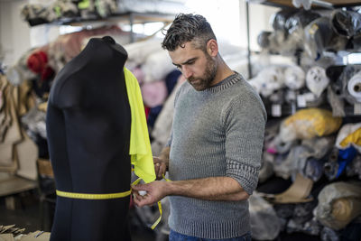 Tailor measuring mannequin in workshop