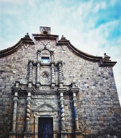 Low angle view of old building against sky